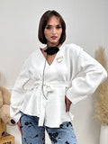 Cardigan con fiocco in vita