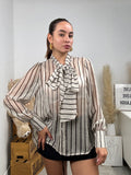 Camicia semitrasparente a righe