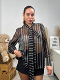 Camicia semitrasparente a righe
