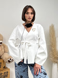 Cardigan con fiocco in vita