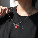 Collana in acciaio con pendente Coca-Cola