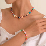 Set di collana e bracciale colorata con fiore