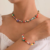 Set di collana e bracciale colorata con frutta