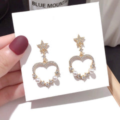 Orecchini a bottoncino in oro giallo e bianco 9kt a forma di cuore con Orecchini a bottoncino in oro giallo e bianco 9kt a forma di cuore con
